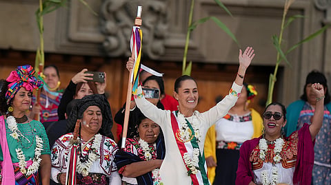 Mexico's President Claudia Sheinbaum waves to supporters in the Zócalo, Mexico City’s main square, on the day of her inauguration, Oct. 1, 2024. 