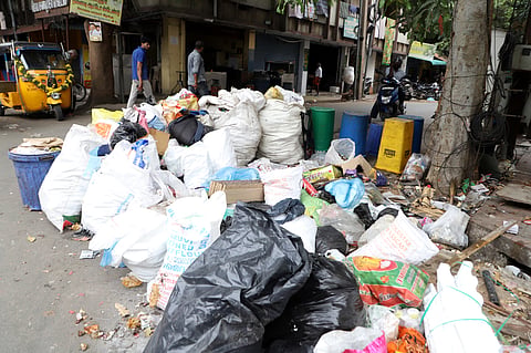 Large number of garbages dumped at open space at Thiyagi Kumaran street in Coimbatore on Friday. 