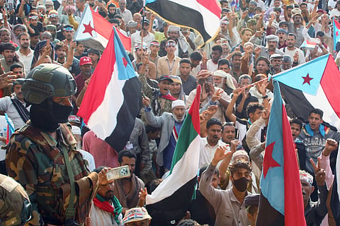Supporters of the Southern Transitional Council, a coalition of separatist groups seeking to restore the state of South Yemen, hold South Yemen flags during a rally, in Aden, Yemen, Friday, Jan 2, 2026.