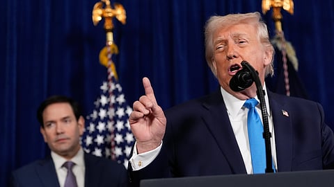 President Donald Trump speaks during a news conference at Mar-a-Lago, Saturday, Jan. 3, 2026, in Palm Beach, Fla., as Secretary of State Marco Rubio listens.