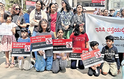 Residents stage a flash protest on 
ECC Road in Whitefield on Sunday 