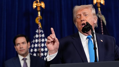 President Donald Trump speaks during a news conference at Mar-a-Lago, Saturday, Jan. 3, 2026, in Palm Beach, Fla., as Secretary of State Marco Rubio listens.