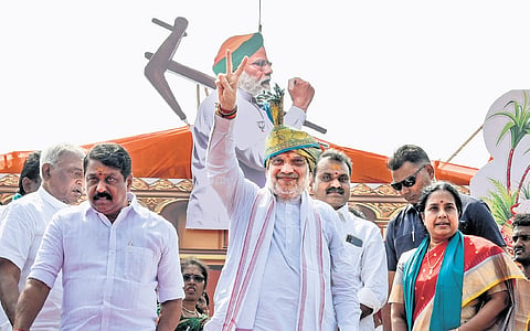 Union Home Minister Amit Shah and (L) state BJP chief Nainar Nagenthran during an event in Tiruchy 