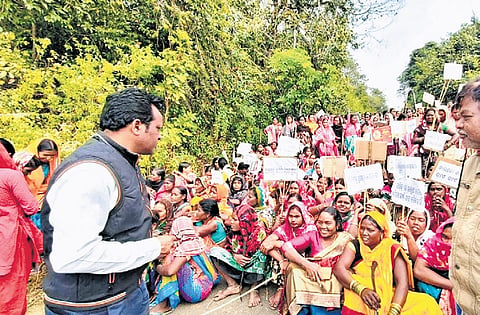 Villagers staging road blockade near Nuagaon in Pottangi block on Monday.