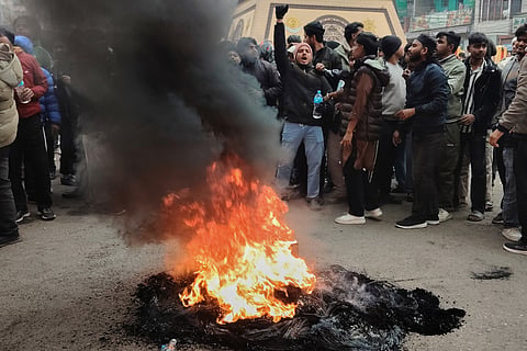 Protesters shout slogans and burn tires as they block main Street in Birgunj, 130 kilometers (81miles) south of Katmandu, Nepal, Sunday, Jan. 4, 2026. 