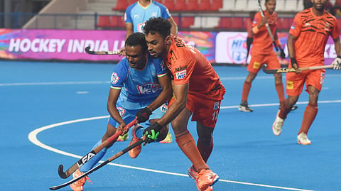Action from the match between HIL GC and Shrachi Bengal Tigers