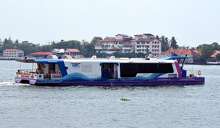 A Water Metro vessel sailing through the Kochi backwaters 