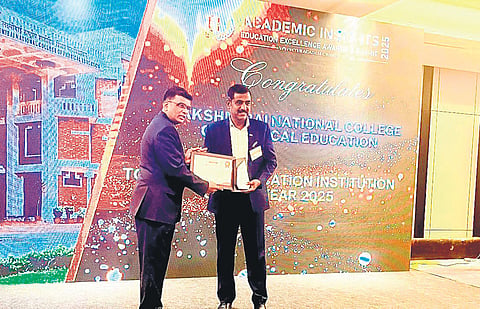 SAI LNCPE principal (in-charge) Pradip Dutta (Right) receiving the Top Sports Education Institution Award