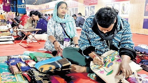 A craftsman at work in the Sisir Saras-2026 fair at Exhibition Ground 