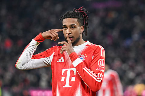 Munich's Michael Olise celebrates scoring during the Bundesliga soccer match between Bayern Munich and VfL Wolfsburg in Munich, Germany, Sunday Jan. 11, 2026. 