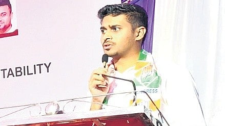 Congress leader Rahul Jarkiholi addresses protesters at the Congress Bhavan in Belagavi on Sunday.