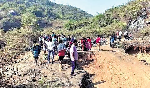 Locals gather at the mishap site near Bhairabi temple in Malkangiri town.