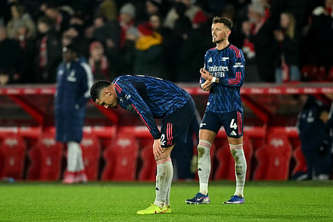Arsenal's French defender #02 William Saliba looks dejected after the English Premier League football match between Nottingham Forest and Arsenal at The City Ground in Nottingham, central England, on January 17, 2026.