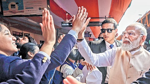 Narendra Modi interacts with students during flagging off the country’s first Vande Bharat sleeper train in Malda 