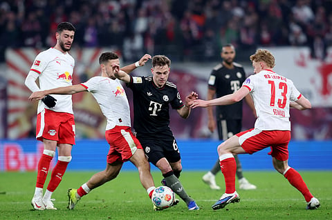  Leipzig's Brazilian forward #40 Romulo Cardoso, Leipzig's Austrian midfielder #14 Christoph Baumgartner, Bayern Munich's German midfielder #06 Joshua Kimmich and Leipzig's Austrian midfielder #13 Nicolas Seiwald vie for the ball during the German first division Bundesliga football match between RB Leipzig and FC Bayern Munich in Leipzig, eastern Germany, on January 17, 2026.