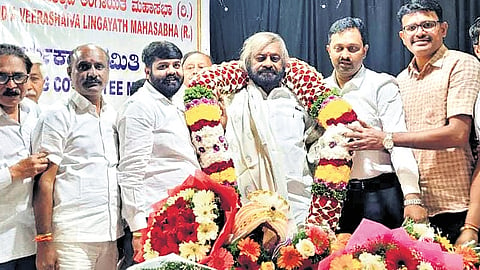 Minister Eshwar Khandre being felicitated after his election as the president 
of All-India Veerashaiva-Lingayat Mahasabha on Tuesday.