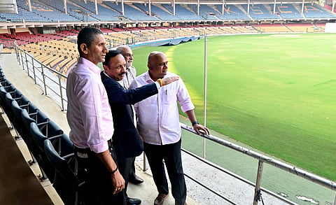 (From L) KSCA president Venkatesh Prasad, and other KSCA office bearers take a look at the ground at the M Chinnaswamy Stadium 