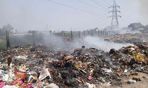 Garbage dumped on the banks of the Noyyal River in Tiruppur. 