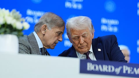 US President Donald Trump, right, speaks with  Shehbaz Sharif, Prime Minister of Pakistan, during a signing of the Board of Peace charter during the Annual Meeting of the World Economic Forum in Davos, Switzerland, Thursday, Jan. 22, 2026.