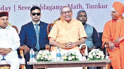 Vice-President CP Radhakrishnan, Governor Thaawarchand Gehlot and Sri Siddalinga Mahaswami at the seventh ‘Samsmaranothsava’ of Sri Shivakumara Swamiji at Siddaganga Mutt in Tumakuru on Wednesday 
