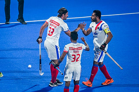 Harmanpreet Singh (R) celebrates with his teammate