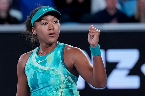Naomi Osaka of Japan reacts after defeating Sorana Cirstea of Romania in their second round match at the Australian Open tennis championship in Melbourne, Australia, Thursday, Jan 22, 2026.