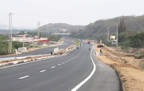 National Highway workers engaged in final works of Outer ring road near Milekal in Coimbatore on Saturday.