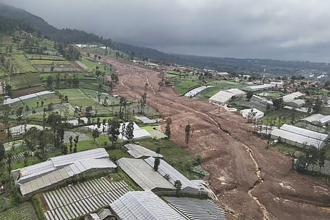 In this photo released by the Indonesian National Search and Rescue Agency (BASARNAS), an aerial shot taken using a drone shows an area affected by landslides in Pasir Langu village, in West Bandung district of West Java province, Indonesia, Saturday, Jan. 24, 2026. 