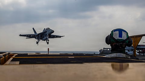 This photo provided by the US Navy shows a Boeing F/A-18E Super Hornet landing on the Nimitz-class aircraft carrier USS Abraham Lincoln in the Indian Ocean on Jan. 22, 2026. 