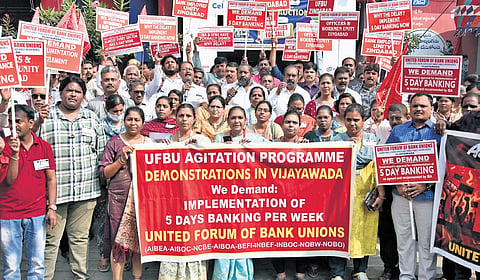 Members of United Forum of Bank Unions states protest demanding 5 day banking per week near One Town in Vijayawada on Tuesday. 