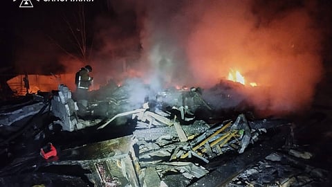 In this photo provided by the Ukrainian Emergency Service, emergency services personnel work to extinguish a fire following a Russian attack in the Zaporizhzhia region, Ukraine, Thursday, Jan. 29, 2026. 