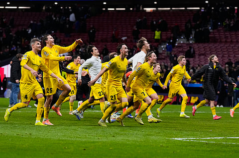 Bodo Glimt players celebrate at the end of the Champions League opening phase soccer match between Atletico Madrid and Bodo Glimt in Madrid, Spain, Wednesday, Jan. 28, 2026. 