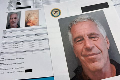 Documents that were included in the U.S. Department of Justice release of the Jeffrey Epstein files are photographed Friday, Jan. 2, 2026.
