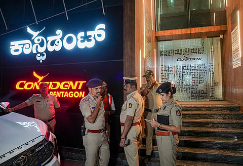 Police personnel stand guard outside Confident Group's office building after the founder and chairman of the real estate firm C J Roy was found dead in the office, in Bengaluru, Karnataka, Friday, Jan. 30, 2026. 