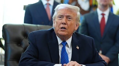 President Donald Trump speaks during an event in the Oval Office of the White House, Friday, Jan. 30, 2026, in Washington.