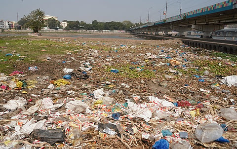 Large amount of garbage especially plastic waste is seen dumped into the Vaigai river in Madurai