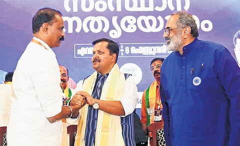 BJP national president Nitin Nabin congratulating Thiruvananthapuram Mayor V V Rajesh during the state-level leadership meet in Kochi on Friday. Party state president Rajeev Chandrasekhar is also seen 