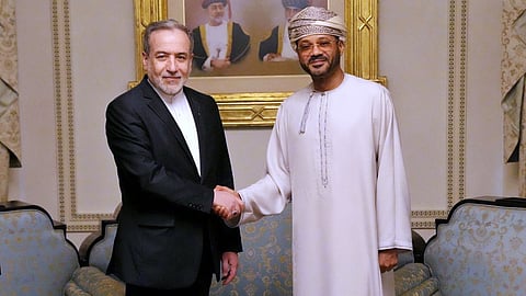 Iranian Foreign Minister Abbas Araghchi, left, shakes hands with his Omani counterpart Sayyid Badr Albusaidi during their meeting prior to Iran and the U.S. negotiations, in Muscat, Oman, Friday, Feb. 6, 2026. 