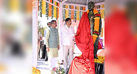 Odisha Governor Hari Babu Kambhampati unveiling the statue of Pabitra Mohan Pradhan. Union Minister Dharmendra Pradhan is also seen.