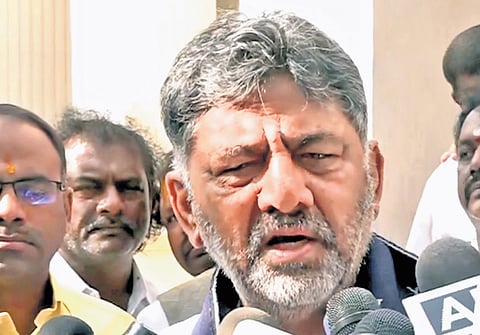 Deputy Chief Minister DK Shivakumar addresses the media before leaving 
for New Delhi, in Bengaluru on Tuesday.