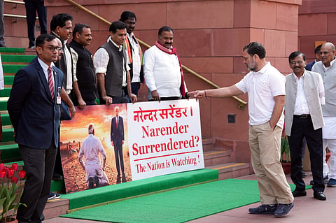 LoP in the Lok Sabha Rahul Gandhi, right, gestures as Lok Sabha MPs who were suspended last week for the remainder of the Budget session protest outside the Parliament. 