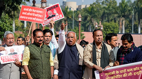 ongress President Mallikarjun Kharge, centre, with party MPs KC Venugopal, Prashant Padole, and others stage a protest over the India-US interim trade deal.