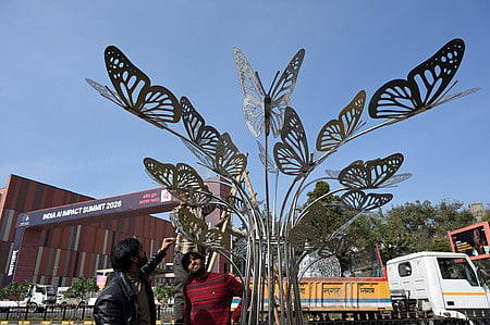Workers engaged in Beautification work near the Bharat Mandapam in New Delhi on February 13, 2026, ahead of the AI Impact Summit in India.