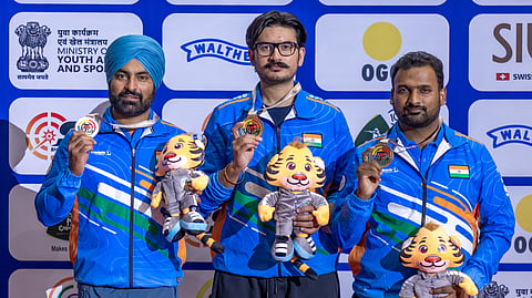 The three winners of the centre fire pistol on Friday