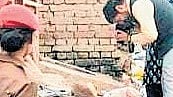 A heavy police deployment, including women police personnel, was present during the investigation to maintain security.