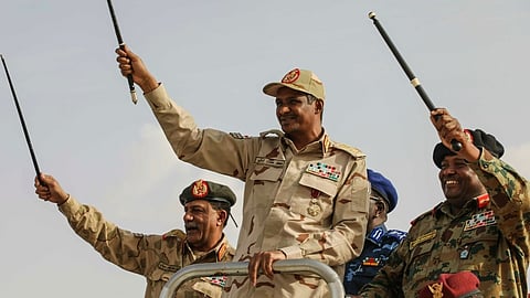 Gen. Mohammed Hamdan Dagalo, center, greets the crowd during a military-backed tribes' rally in the Nile River State of Sudan, on Saturday, July 13, 2019.