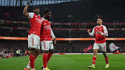 Arsenal's Noni Madueke (L) celebrates after scoring the team's first goal during the English FA Cup fourth round football match between Arsenal and Wigan Athletic at the Emirates Stadium in London on February 15, 2026.