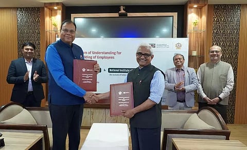 Senior officials of NIT, Rourkela and Odisha Mining Corporation exchaing copies of Memorandum of Understanding.