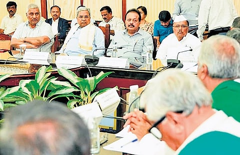 Chief Minister Siddaramaiah chairs a pre-budget meeting with farmers at 
Vidhana Soudha in Bengaluru on Tuiesday 