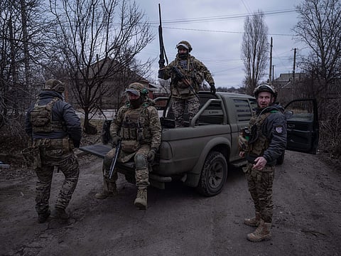 In this photo provided by Ukraine's 93rd Kholodnyi Yar Separate Mechanized Brigade press service, soldiers are at a pickup before assignments on the frontline near Kostyantynivka, Donetsk region, Ukraine, Tuesday, Feb. 17, 2026. 